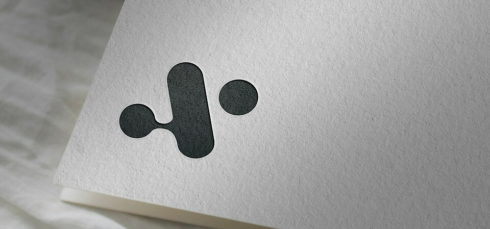 Aiomics Logo on paper